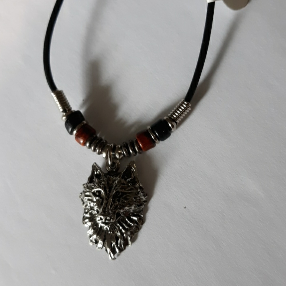 Wolf face silver necklace on black cord necklace